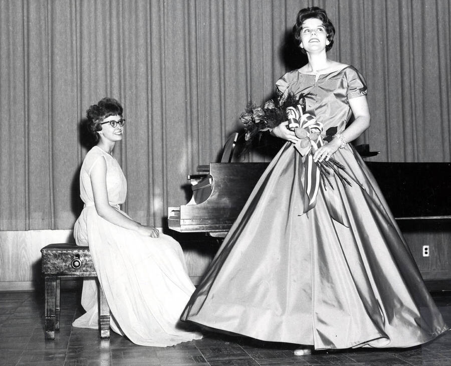 1962 photograph of Music Department. Linda Smith performing during a senior recital accompanied by Angela Sherbenou. Donor: Publications Dept. [PG1_222-031]