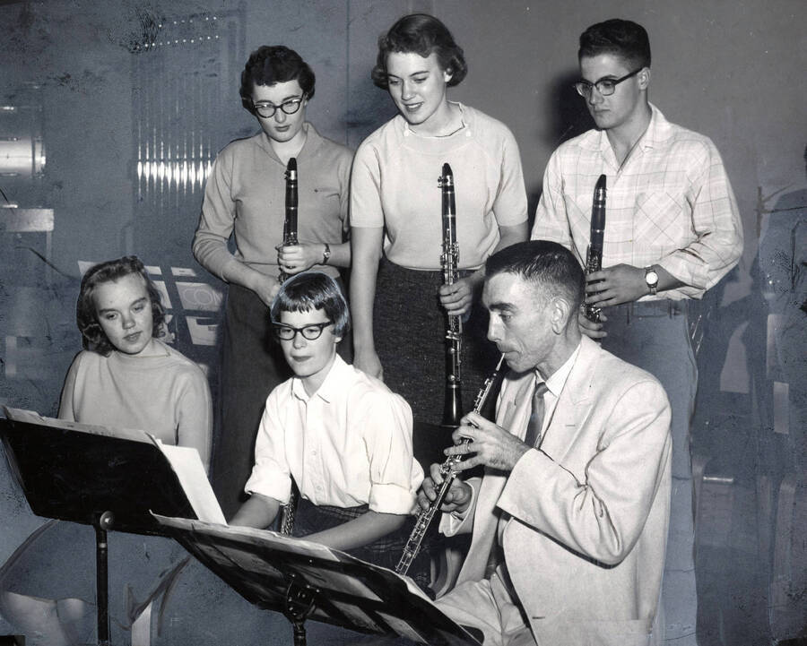 1951 photograph of Music Department. Warren Bellis and clarinet students. Print surface airbrushed and painted. Donor: Publications Dept. [PG1_222-049]
