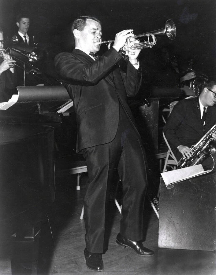 1952 photograph of Music Department. Bud Brisbois performing a trumpet solo on stage. Donor: Publications Dept. [PG1_222-058]