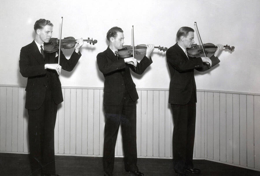 1933 photograph of Music Department. Violinists Wendell Olsen, Dick Edwards, and Bill Ames. [PG1_222-006]