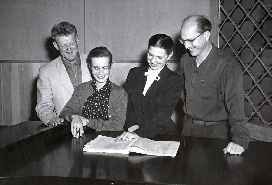 1956 photograph of Music Department. Vocal quartet Rex Eikum, Karen Hurdstrom, Eleanor Skok, and Norman Logan during the Inland Empire Music Festival. Donor: Publications Dept. [PG1_222-062]