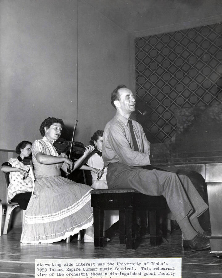 1955 photograph of Music Department. Orchestra rehearsing during the Inland Empire Summer Music Festival. Donor: Publications Dept. [PG1_222-063]