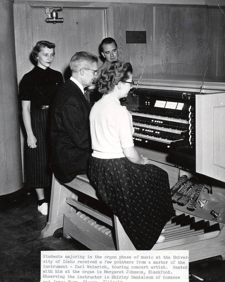 1956 photograph of Music Department. Organ students Shirley Danielson, Carl Weinrich, touring artist, James Horn, and Margaret Johnson. Donor: Publications Dept. [PG1_222-064]