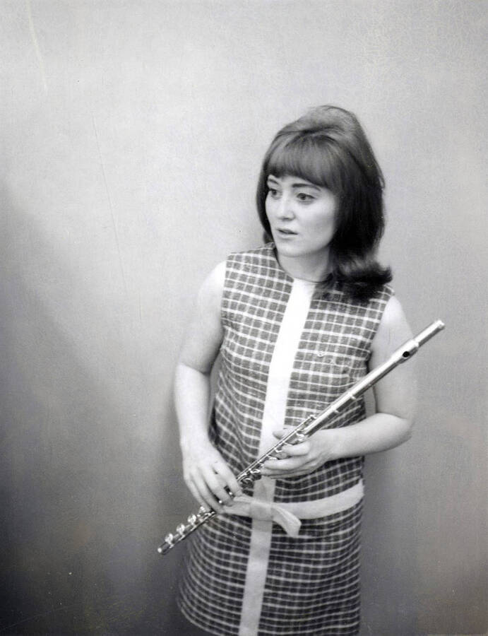 1966 photograph of Music Department. Susan Norell holding a flute. Donor: Publications Dept. [PG1_222-065]
