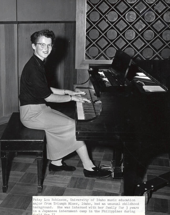 1954 photograph of Music Department. Patsy Lou Robinson playing the piano. Donor: Publications Dept. [PG1_222-066]