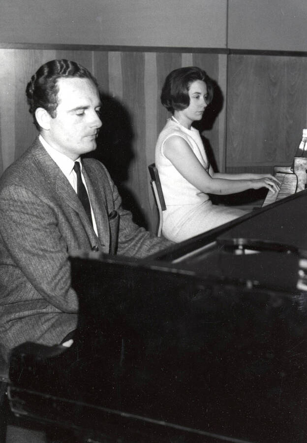 1963 photograph of Music Department. Paula and David Tyler performing on pianos. Donor: Publications Dept. [PG1_222-077]