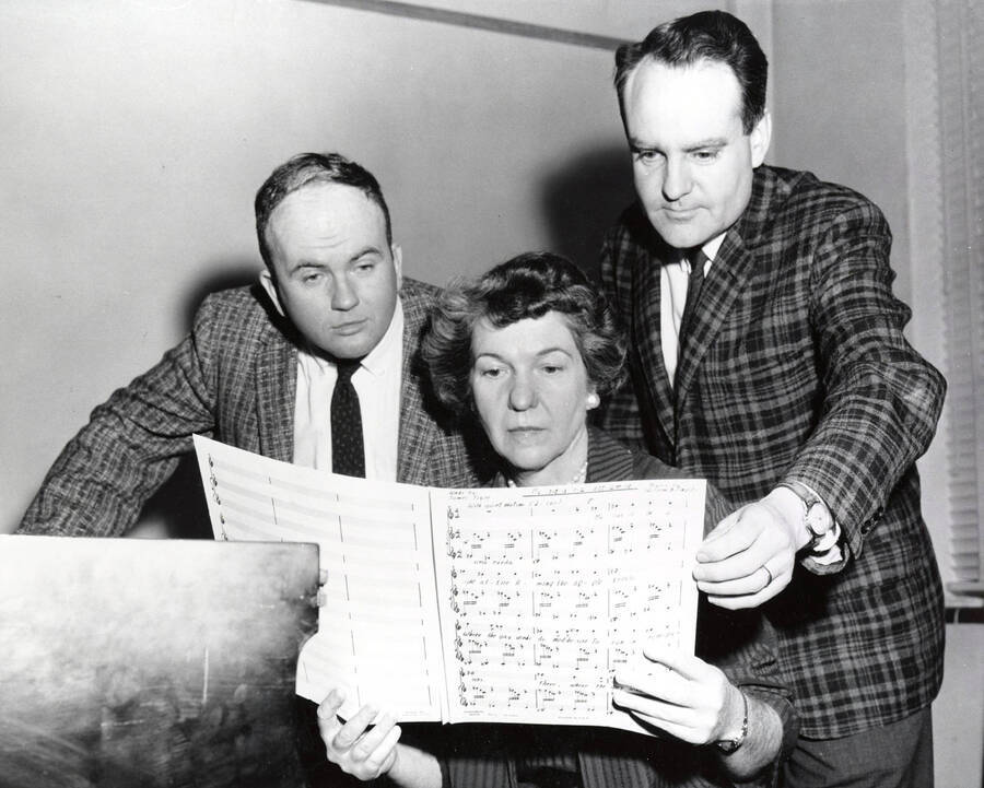 1958 photograph of Music Department. Charles Walton, Marian Frykman, and William Billingsley studying a score by Billingsley Donor: Publications Dept. [PG1_222-080]