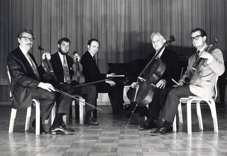 1970 photograph of Music Department. Music Faculty String Quartet LeRoy Bauer, Brice Farrar, David J. Tyler, W. Howard Jones and an unidentified man. [PG1_222-086]