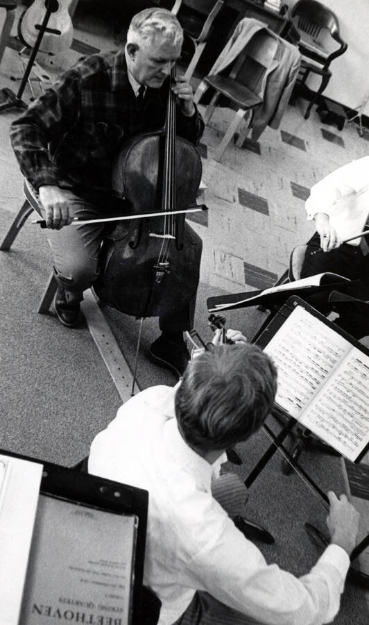 W. Howard Jones playing cello. Music, University of Idaho. [222-94]