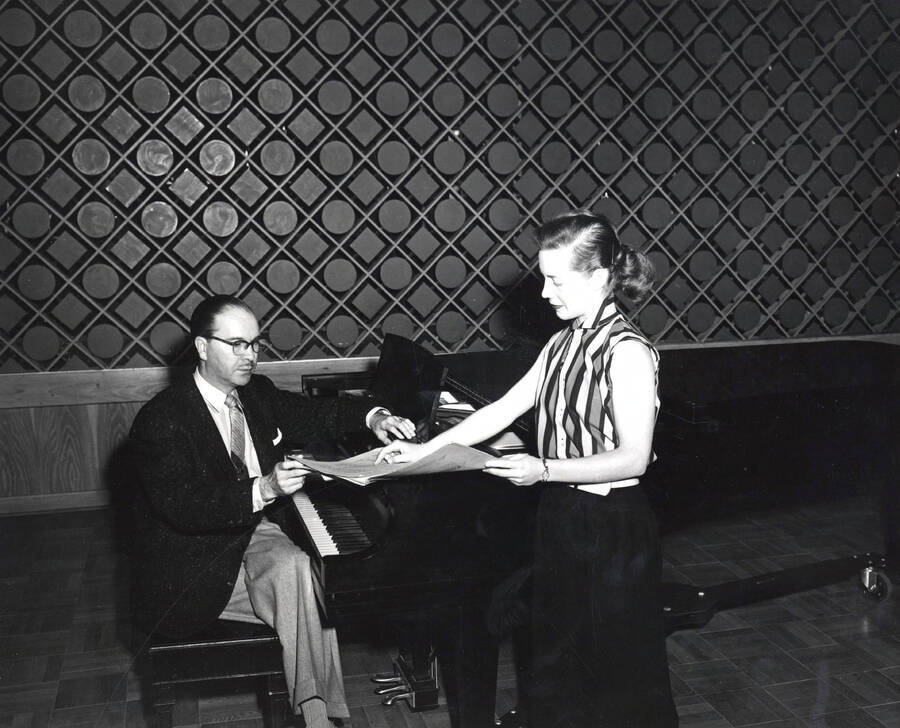 1956 photograph of Music Department. Hall M. Macklin with Karen Hurdstrom at the piano. [PG1_222-097]