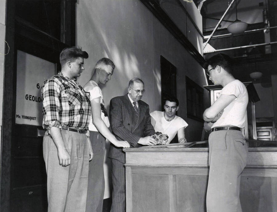 1953 photograph of College of Mines. Professor William W. Staley with students. [PG1_223-14]