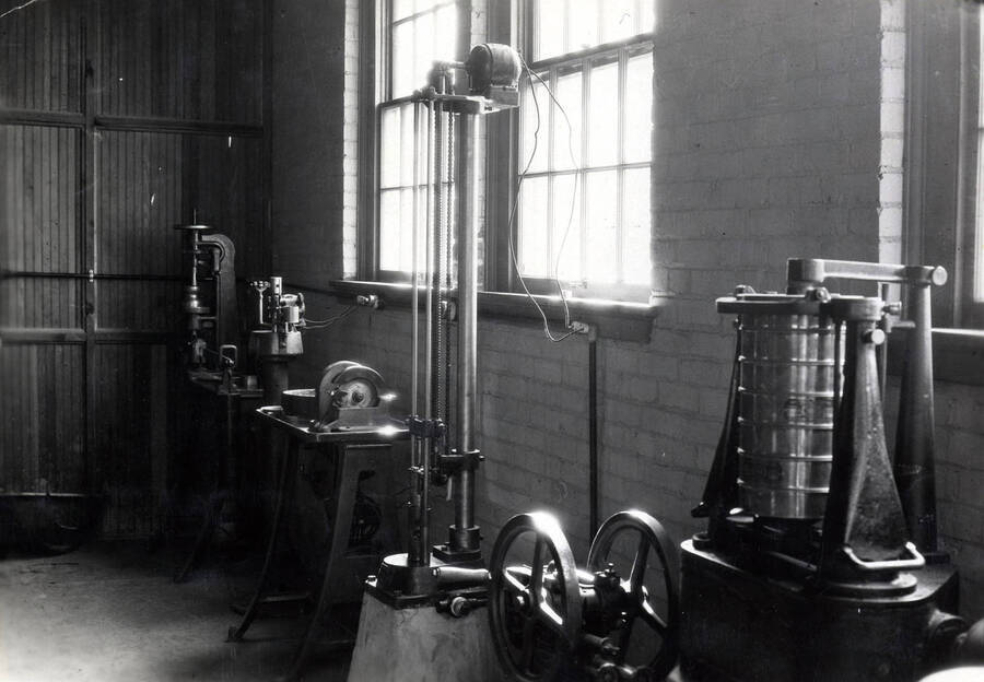 1922 photograph of College of Engineering. Equipment in the highway laboratory. [PG1_224-11]