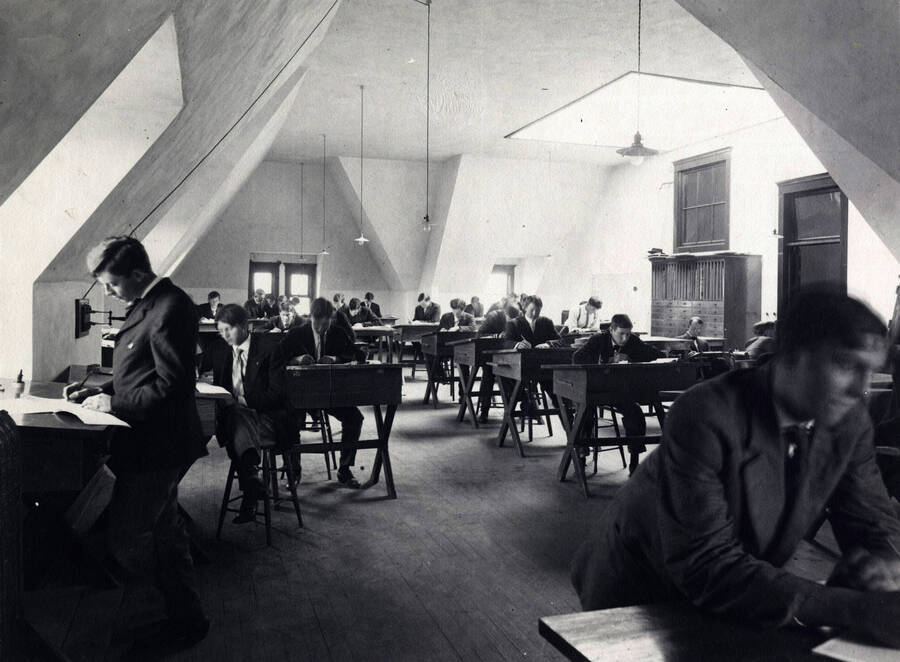 1907 photograph of College of Engineering. Students at drafting desks during class. [PG1_224-28]
