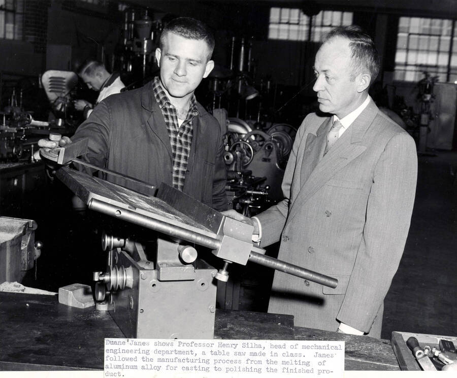 1962 photograph of College of Engineering. Duane James shows Prof. Henry Silha table saw made in class. [PG1_224-38]