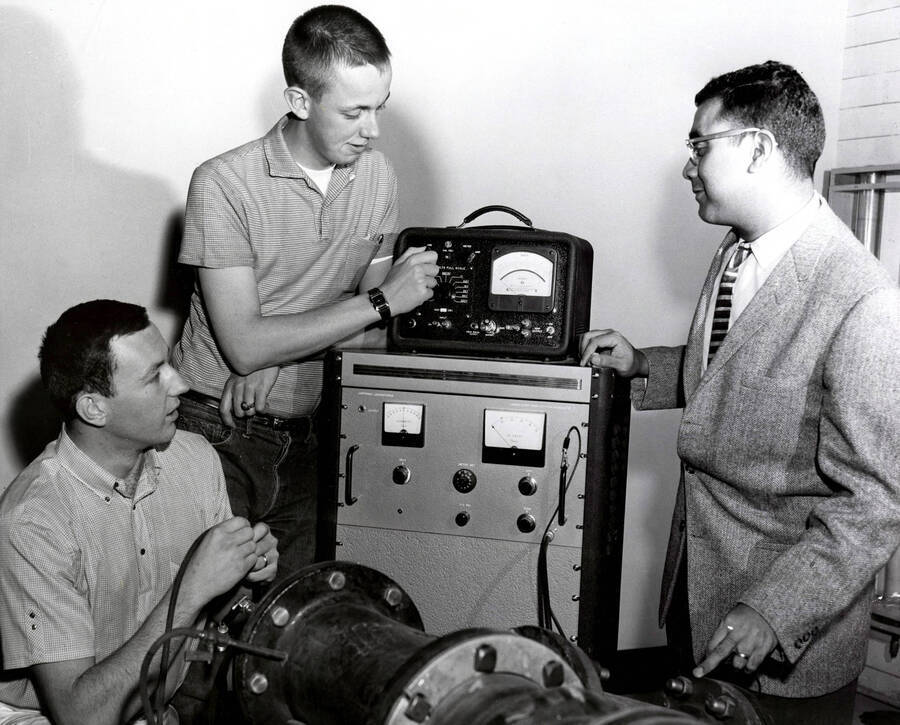 College of Engineering. University of Idaho. James Okeson, David D. Powers, and Godfrey Q. Martin checking a hot film anemometer. [224-44a]