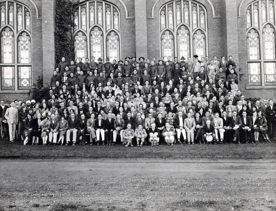 1928 photograph of College of Business Administration. Group photograph in front of the Memorial Gymnasium. [PG1_225-02]