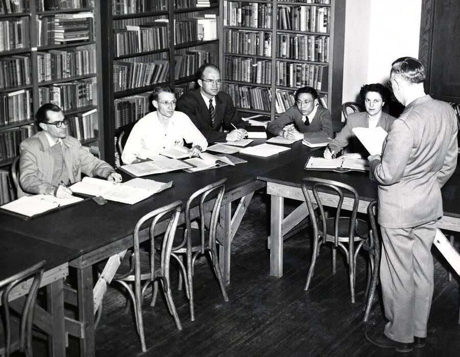 1949 photograph of College of Education. Students sttanding a workshop. [PG1_227-02]