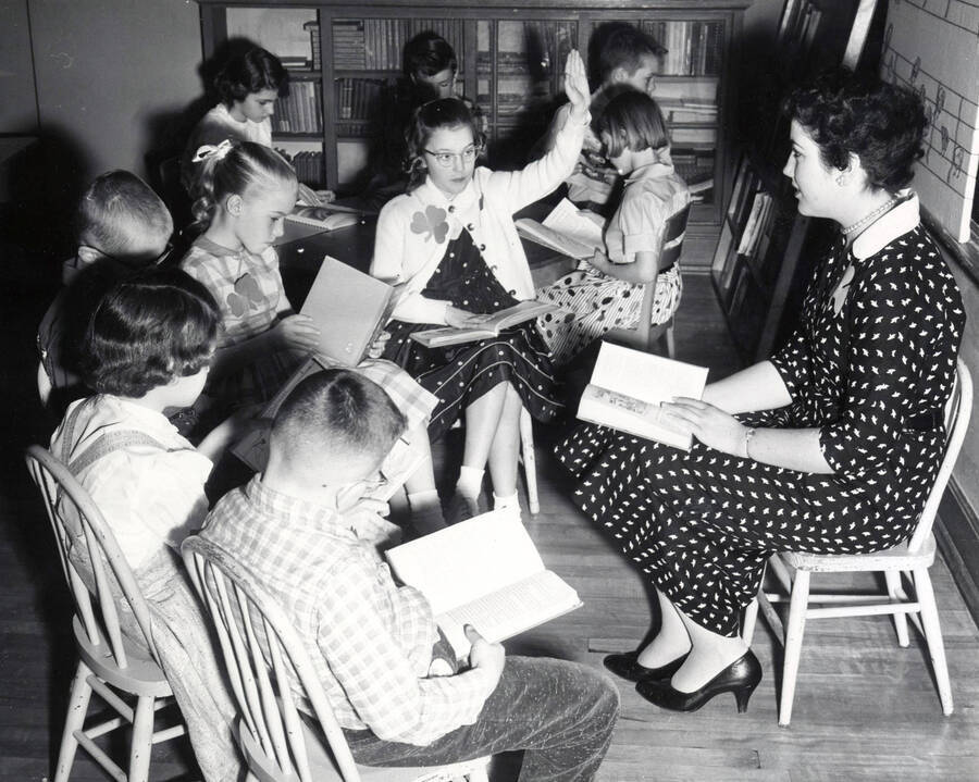 1953 photograph of College of Education. A student teacher instructs a classroom. [PG1_227-04]