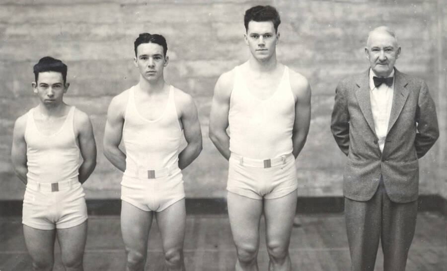 1933 photograph of Physical Education. Eric Newton Meneely, Henry Alfred Wilson, Benjamin Gene Wilcox, and Coach Ralph Fielding Hutchison. [PG1_230-02b]