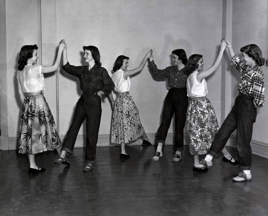 1932 photograph of Physical Education. Female students dancing together during class. Donor: Publications Dept. [PG1_231-12]
