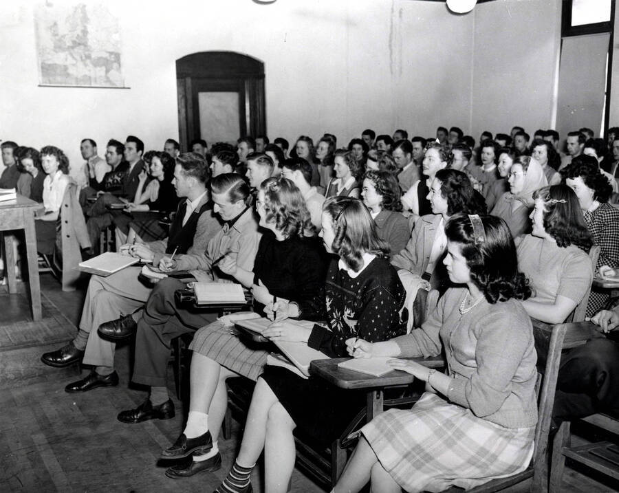 1940 photograph of European history class. Students attending a lecure hall in the Science Hall. [PG1_233-01]