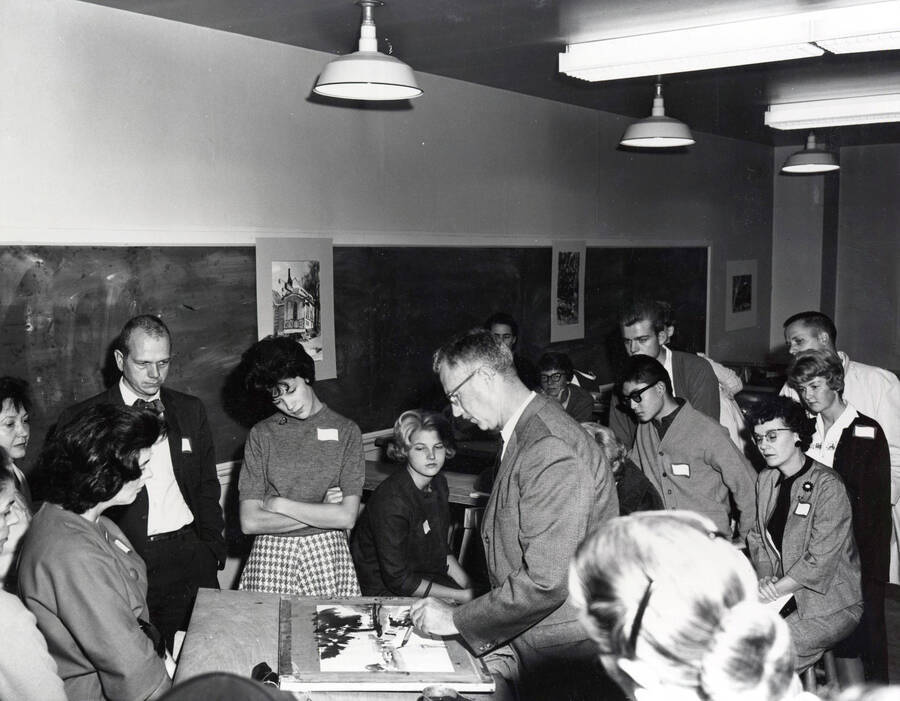 1966 photograph of Art and Architecture. Alfred Dunn demonstrating his painting technique to students during class. Donor: Publications Dept. [PG1_241-10]