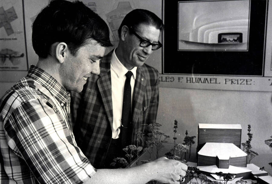 1965 photograph of Art and Architecture. Charles Bartell and student preparing a model of buildings. Donor: Publications Dept. [PG1_241-14]