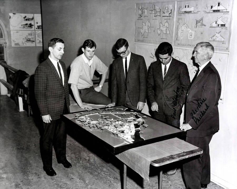 1967 photograph of Art and Architecture. William McCroskey, Paul Blanton, Theodore Prichard, and two unidentified men examining a model of a map. Donor: Publications Dept. [PG1_241-18]
