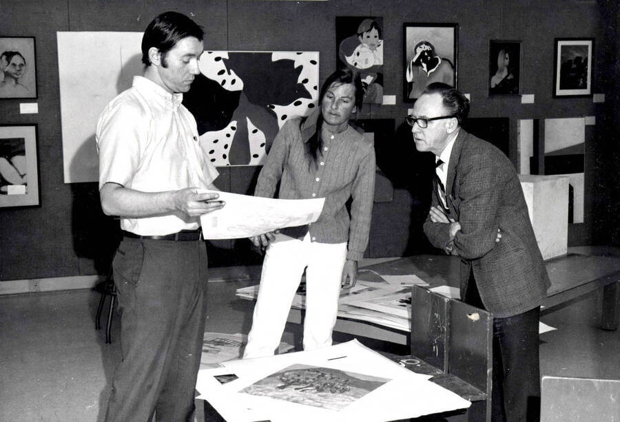 1966 photograph of Art and Architecture. Arnold S. Westerlund and Genevra Sloan examining art. Donor: Publications Dept. [PG1_241-19]