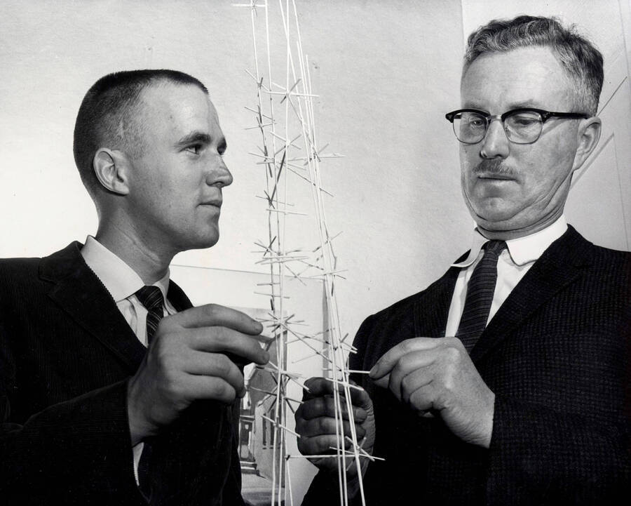 1961 photograph of Art and Architecture. Iain Baxter and Alf Dunn examine a sculpture. Donor: Publications Dept. [PG1_241-21b]