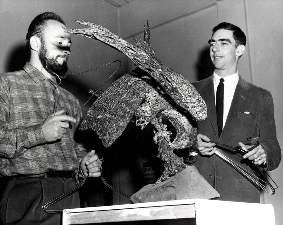 1962 photograph of Art and Architecture. George Roberts and a student look at a sculpture of a bird. Donor: Publications Dept. [PG1_241-23]
