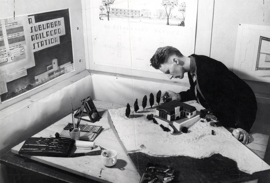 1936 photograph of Art and Architecture. Richard Maxwell finishing a model of a building. Donor: Publications Dept. [PG1_241-28]