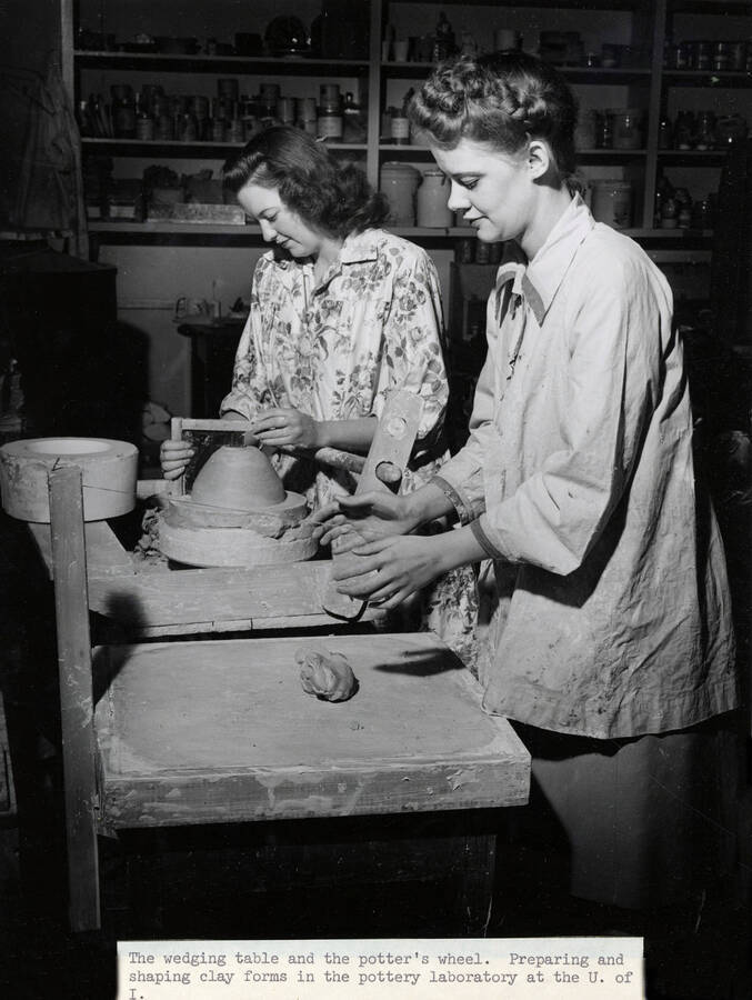 1947 photograph of Art and Architecture. Two students work at a wedging table and a potter's wheel. Donor: Publications Dept. [PG1_241-35]