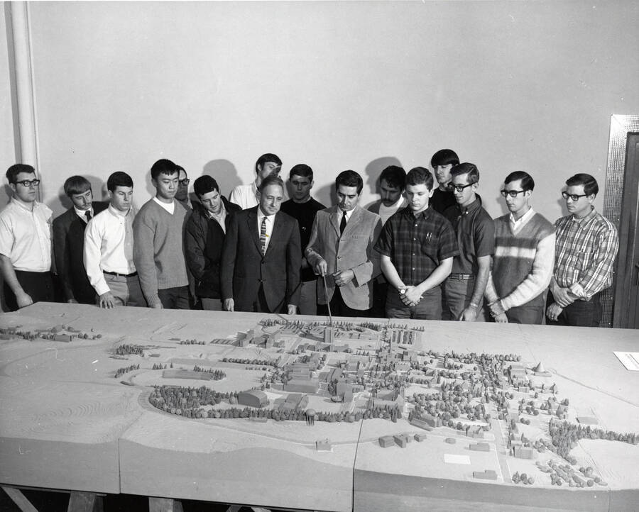 1970 photograph of Art and Architecture. Students examine a model of campus. Donor: Publications Dept. [PG1_241-38]
