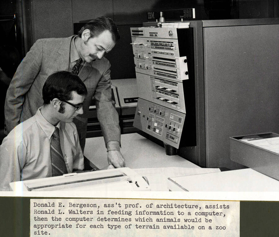 Art and Architecture. University of Idaho. Professor Donald E. Bergeson assists student Ronald L. Walters use computer to determine zoo needs for project. [241-7]