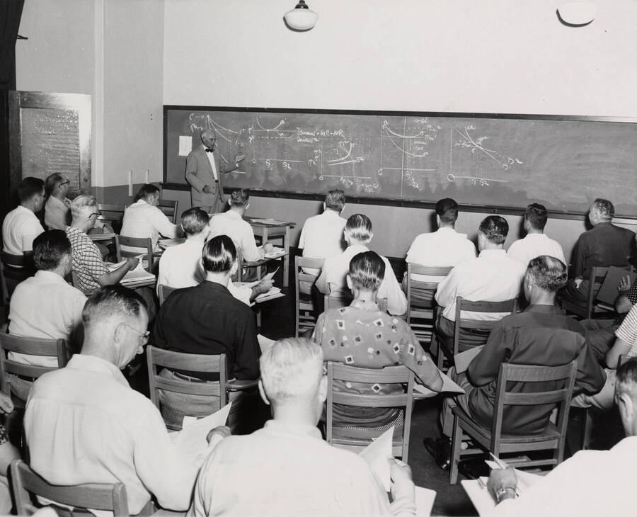 1954 photograph of Economics class. Dr. Erwin Graue lecturing a class. Donor: Publications Dept. [PG1_243-02]