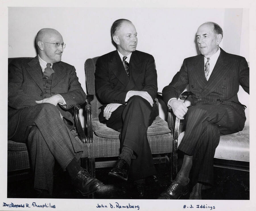 John David Remsberg, Jr., first University of Idaho graduate appointed to Board of Regents, visits E.J. Iddings (right) and Donald R. Theophilus (left). [245-2]
