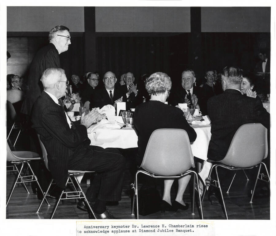 1964 photograph of 75th Anniversary. Dr. Lawrence H. Chamberlain acknowledges applause during the Diamon Jubilee. [PG1_246-20]