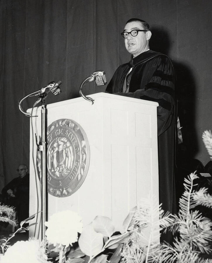 1964 photograph of 75th Anniversary. Governor Robert E. Smylie at lectern during the convocation. [PG1_246-07]