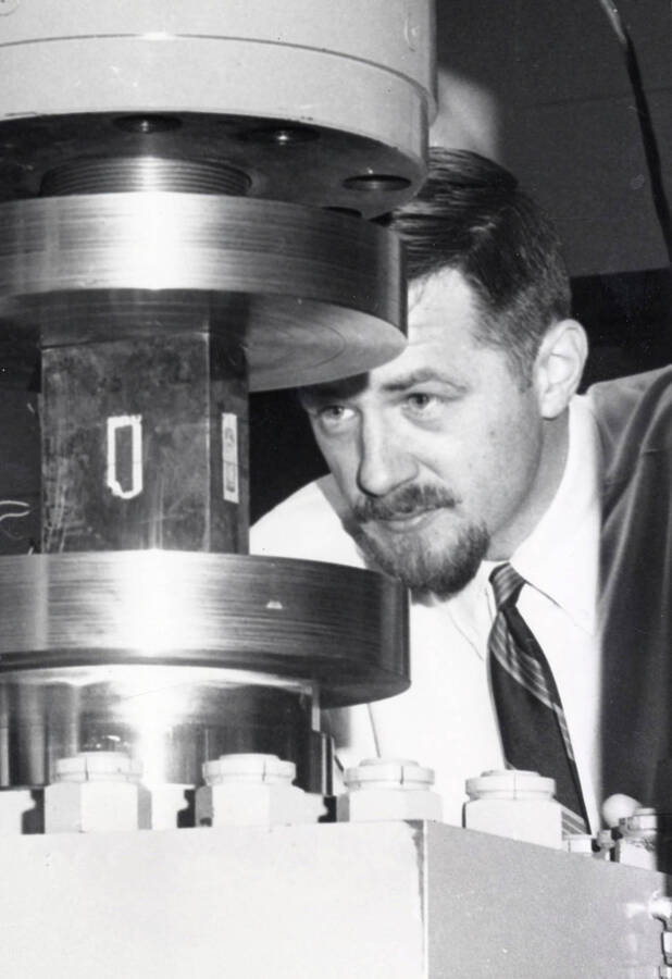1966 photograph of Civil engineering. Thomas Anderson using lab equipment. [PG1_252-01]