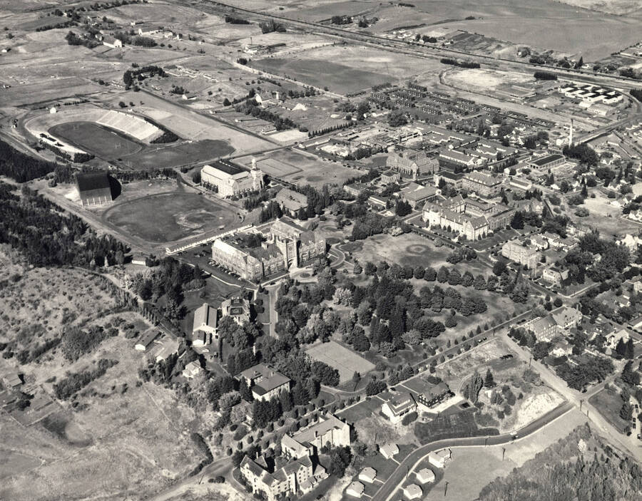 1950 photograph of University of Idaho campus. Aerial view shows both Neale Stadium and the baseball diamond. Donor: Publications Dept. [PG1_003-14]