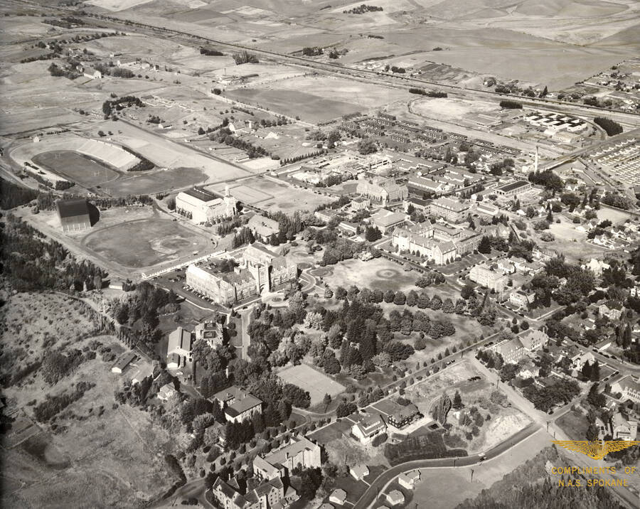 1950 photograph of University of Idaho campus. Aerial view shows Neale Stadium. Donor: Athletic Dept. [PG1_003-14b]