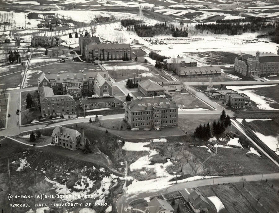1950 photograph of University of Idaho campus. Aerial view shows Morrill Hall in the center. Donor: Publications Dept. [PG1_003-16]