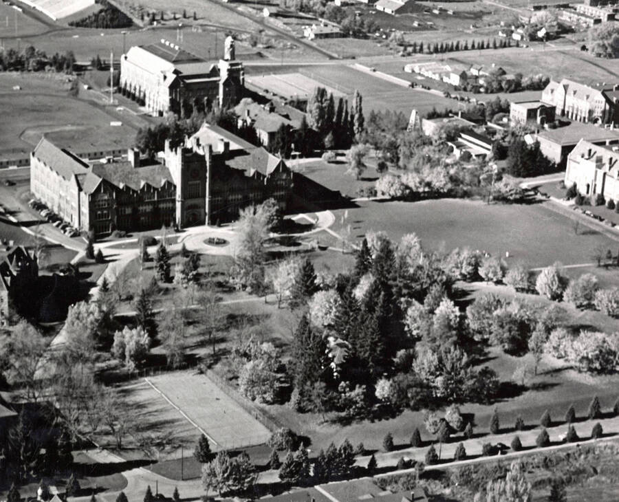 1950 photograph of University of Idaho campus. Aerial view shows tennis courts in lower left. Donor: Publications Dept. [PG1_003-18]