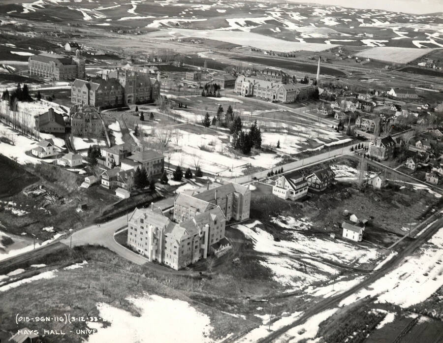 1933-03-12 photograph of University of Idaho campus. Aerial view shows Hays Hall on the left. Donor: Publications Dept. [PG1_003-19]
