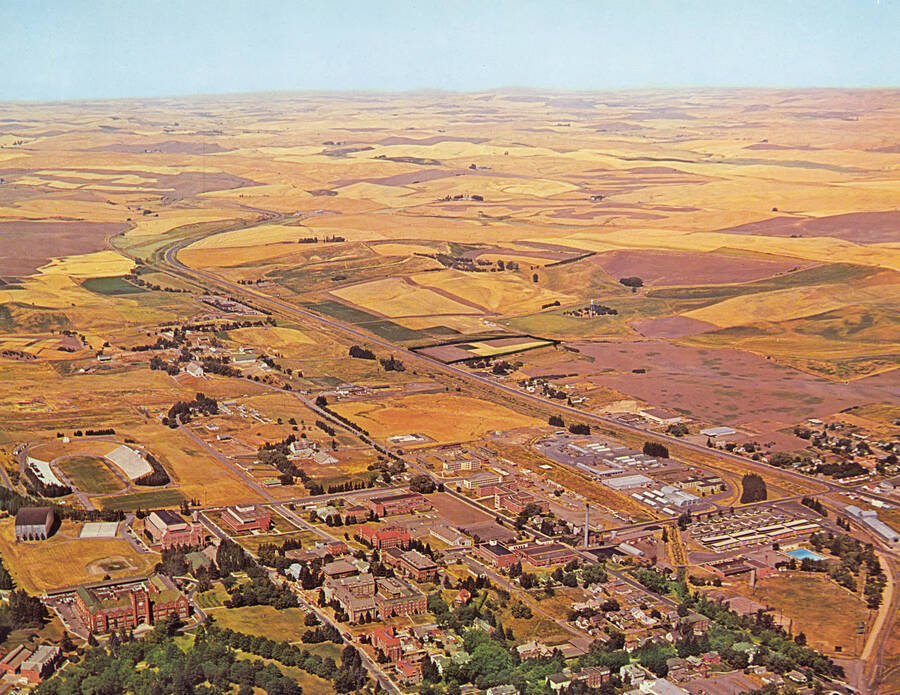 1960 photograph of University of Idaho campus. A color aerial view shows surrounding farm fields. [PG1_003-26]