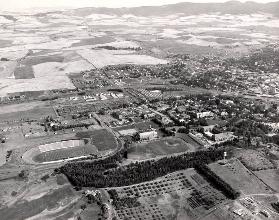 1951 photograph of University of Idaho campus. Aerial view shows both campus and Moscow. [PG1_003-31]