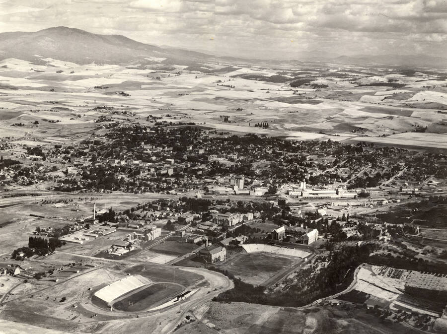 1938 photograph of University of Idaho campus. Aerial view shows both campus and Moscow. [PG1_003-07]