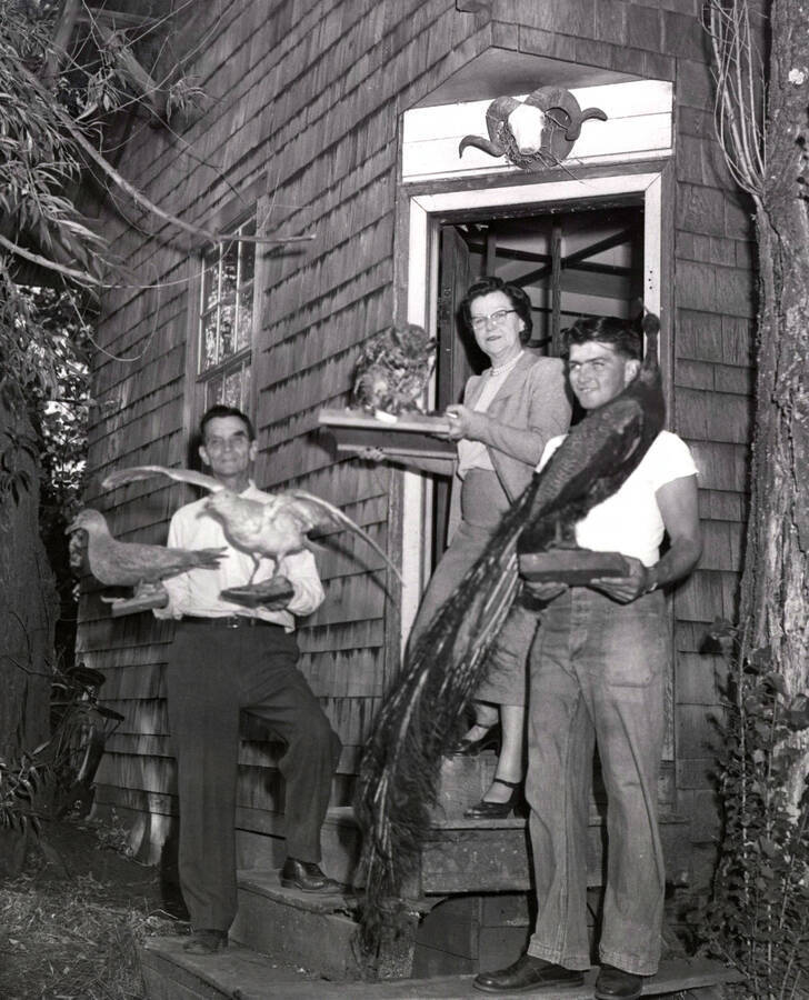 1953 photograph of Gifts. l-r: Henry Lorang, Bertha Kennedy, Dan Lorang. Donor: Publications Dept. [PG1_400-15a]