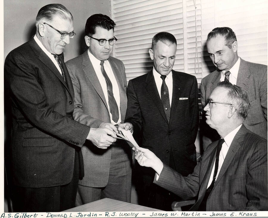 1958 photograph of Gifts. l-r: A.S. Gilbert, Donald L. Jordin, R.J. Wooley, James W. Martin, and James E. Kraus. Donor: Publications Dept. [PG1_400-23]